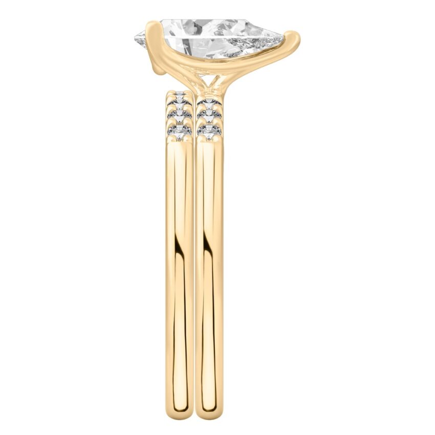 Side view of pear shape diamond minimalist pave engagement ring set yellow gold