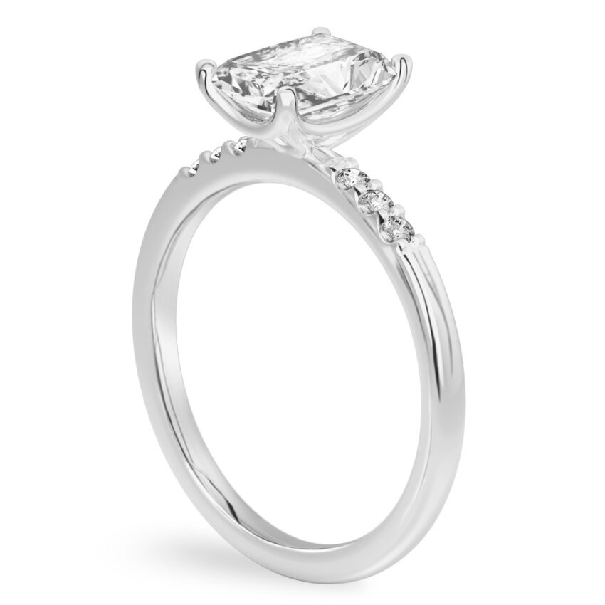 Angle view of radiant cut diamond minimalist pave engagement ring in platinum