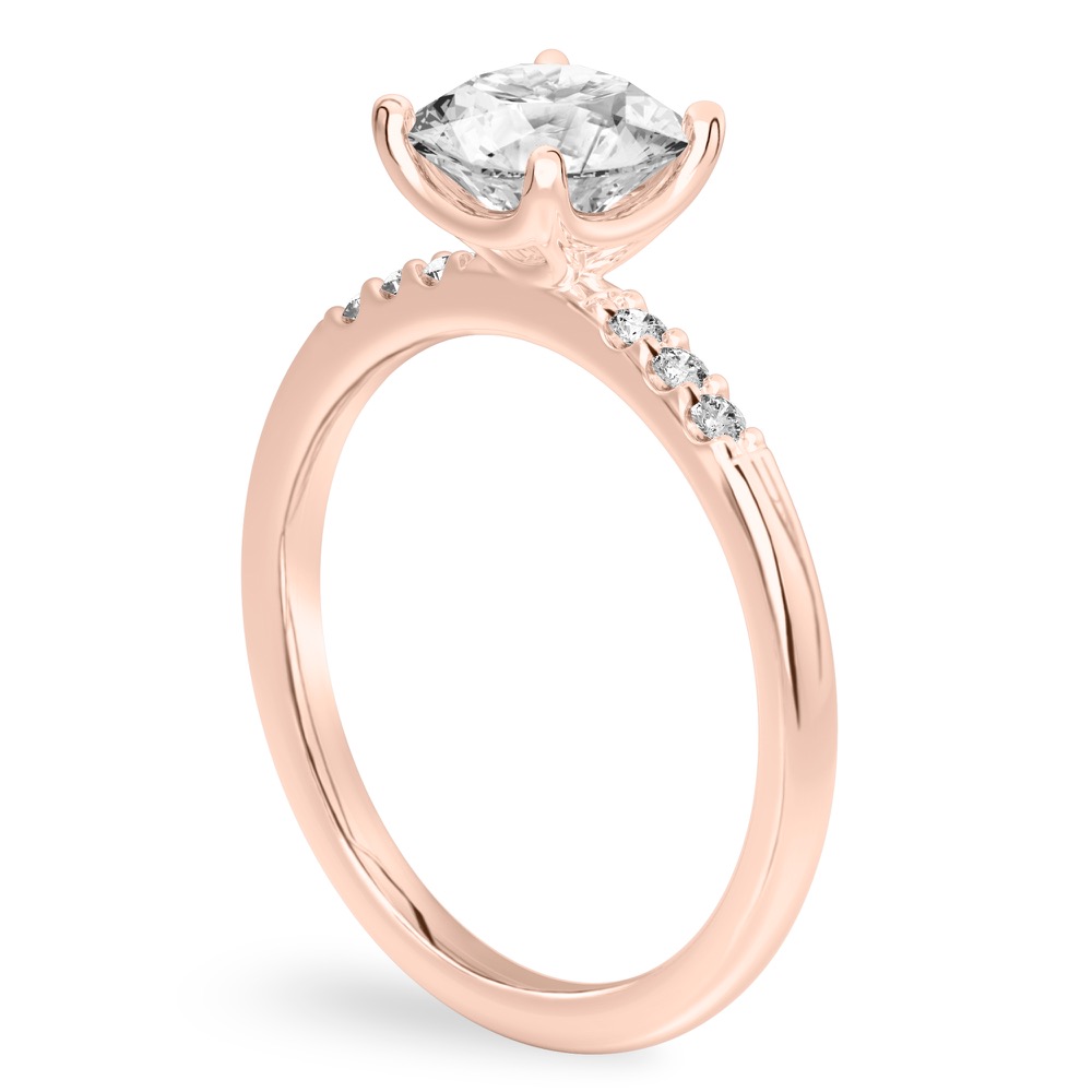 Angle view of round cut diamond minimalist pave engagement ring in rose gold
