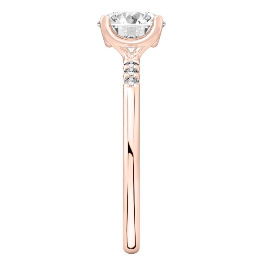 Side view of round cut diamond minimalist pave engagement ring in rose gold