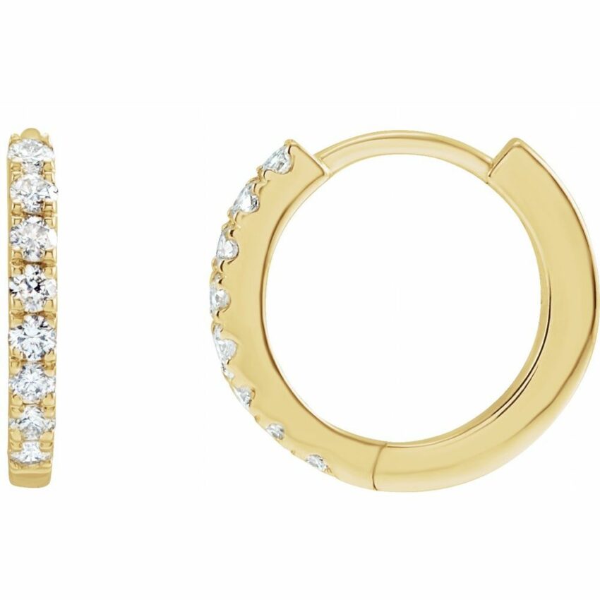 Angle view of 12mm diamond huggie earrings yellow gold