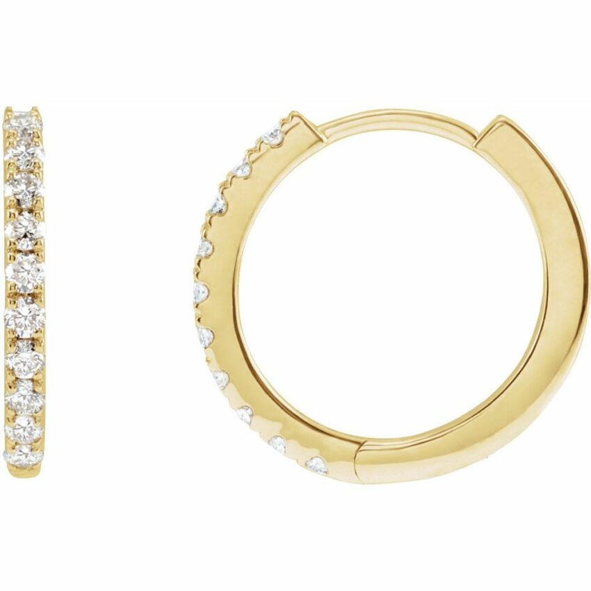 Angle view of 14mm diamond huggie earrings yellow gold