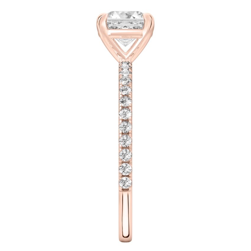 Side view of asscher cut diamond delicate pave engagement ring in rose gold
