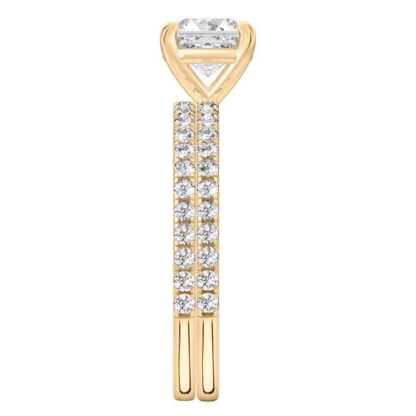 Side view of asscher cut diamond delicate pave engagement ring set yellow gold