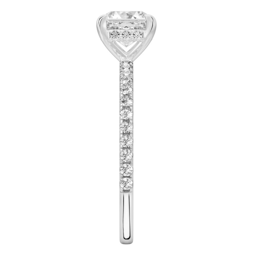 Side view of asscher cut diamond delicate pave hidden halo engagement ring in platinum
