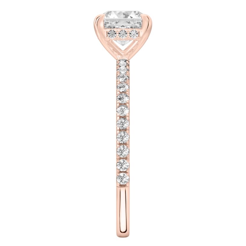 Side view of asscher cut diamond delicate pave hidden halo engagement ring in rose gold