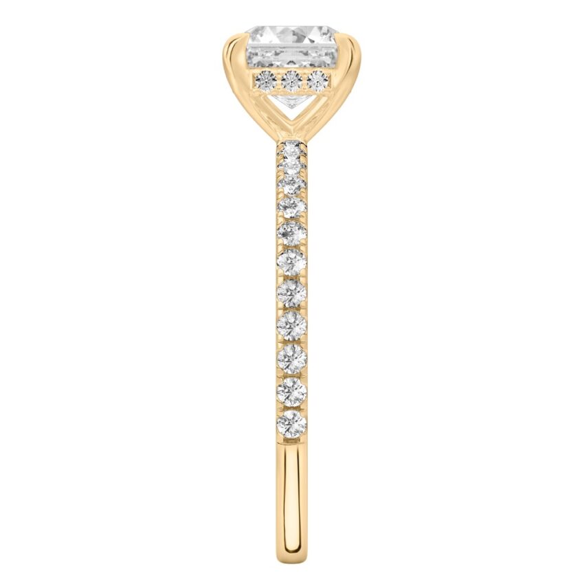 Side view of asscher cut diamond delicate pave hidden halo engagement ring in yellow gold