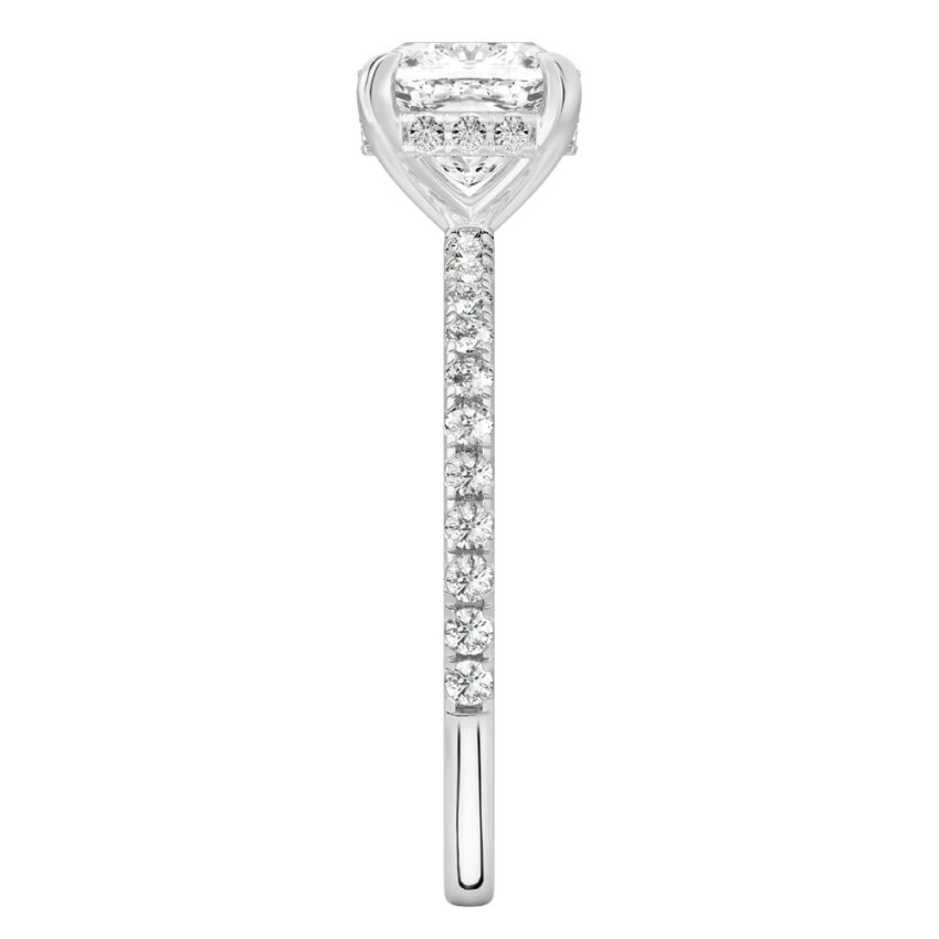 Side view of cushion cut diamond delicate pave hidden halo engagement ring in platinum