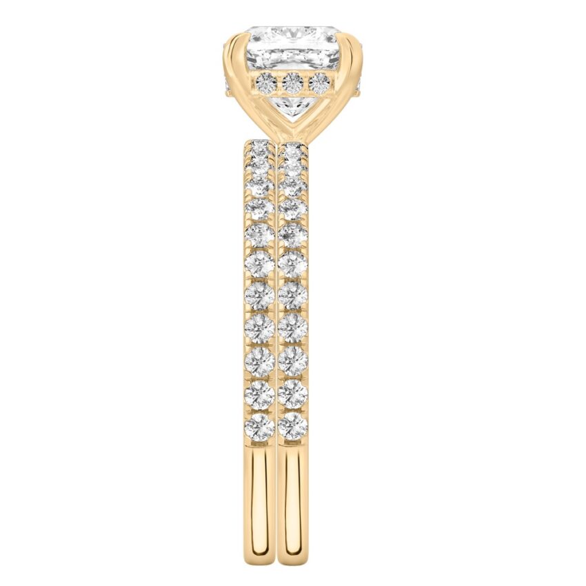Side view of cushion cut diamond delicate pave hidden halo engagement ring set yellow gold