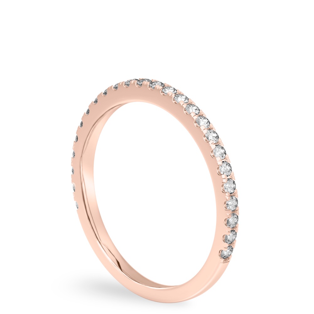 Angle view of delicate pave diamond wedding band in rose gold