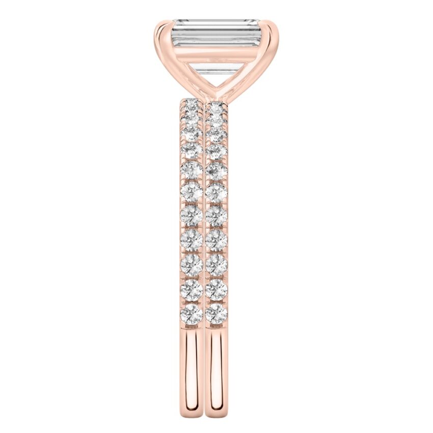 Side view of emerald cut diamond delicate pave engagement ring set rose gold