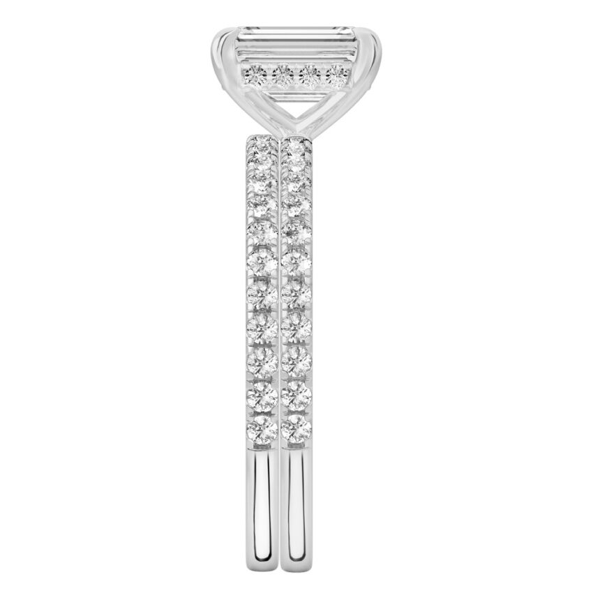 Side view of emerald cut diamond delicate pave hidden halo engagement ring set platinum