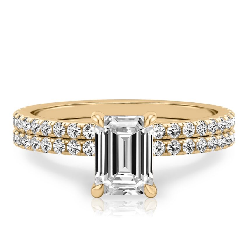 emerald cut diamond delicate pave hidden halo engagement ring set yellow gold