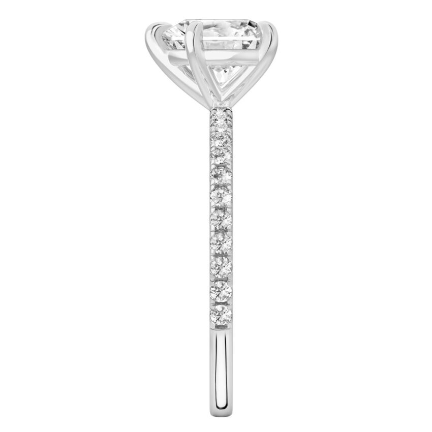 Side view of heart shape diamond delicate pave engagement ring in platinum