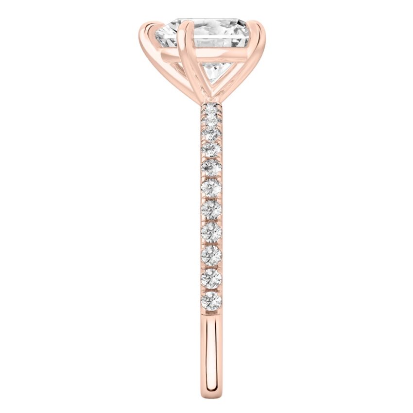 Side view of heart shape diamond delicate pave engagement ring in rose gold