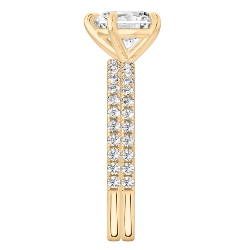 Side view of heart shape diamond delicate pave engagement ring set yellow gold