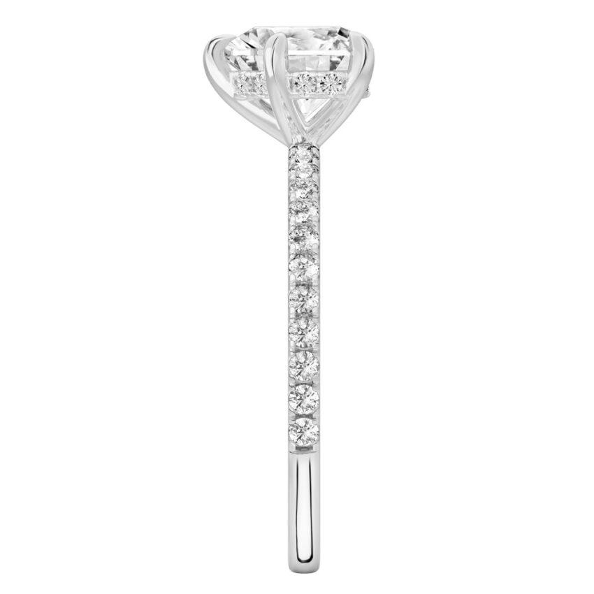 Side view of heart shape diamond delicate pave hidden halo engagement ring in platinum