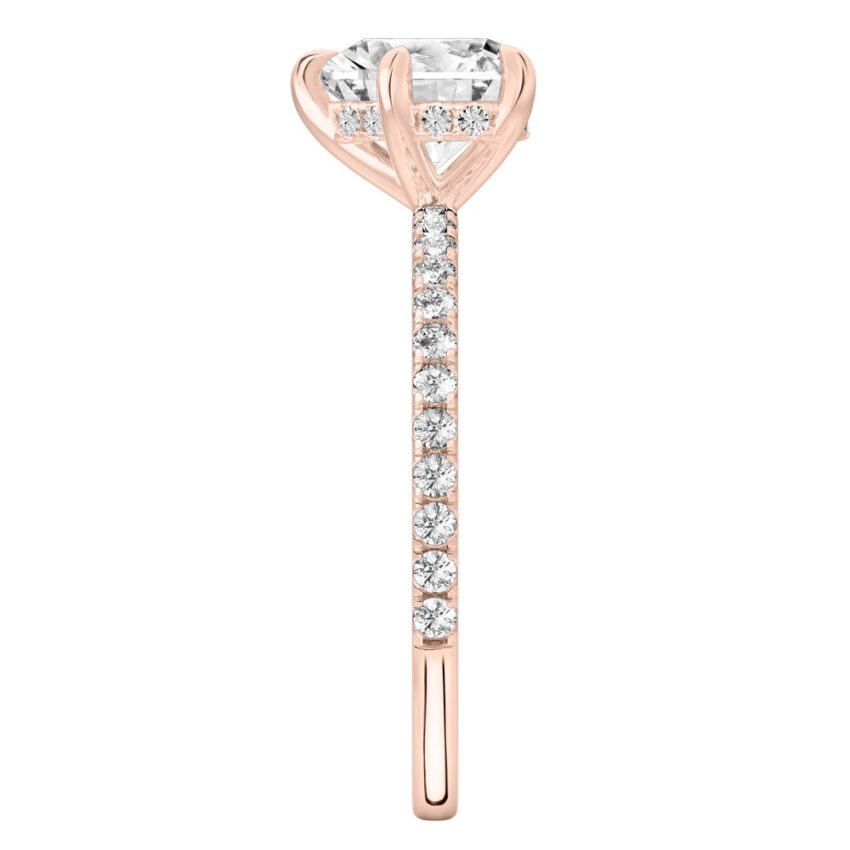 Side view of heart shape diamond delicate pave hidden halo engagement ring in rose gold