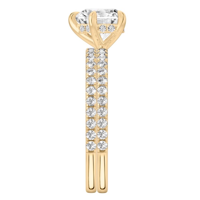 Side view of heart shape diamond delicate pave hidden halo engagement ring set yellow gold