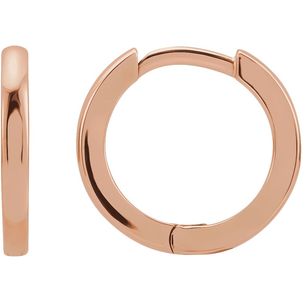 Angle view of huggie earrings rose gold