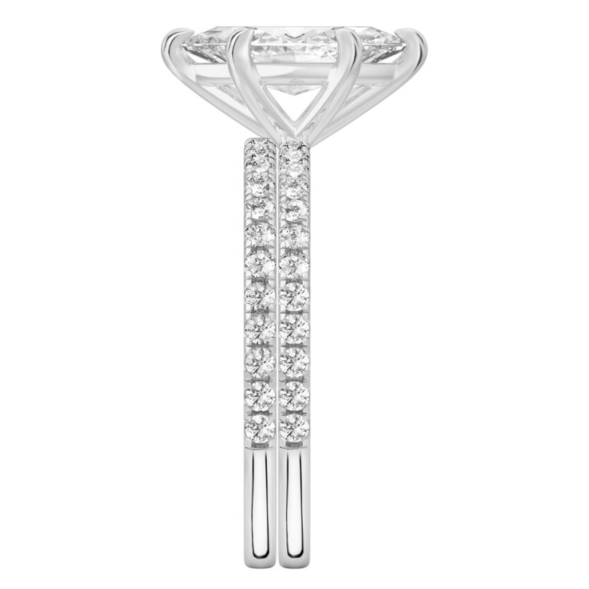Side view of marquise cut diamond delicate pave engagement ring set platinum