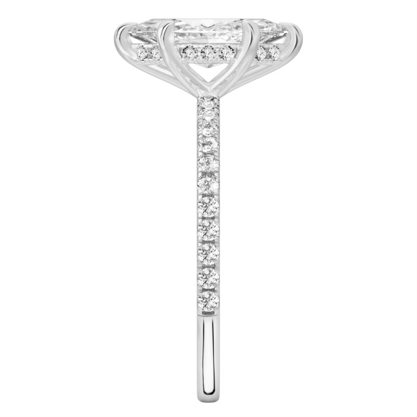 Side view of marquise cut diamond delicate pave hidden halo engagement ring in palladium