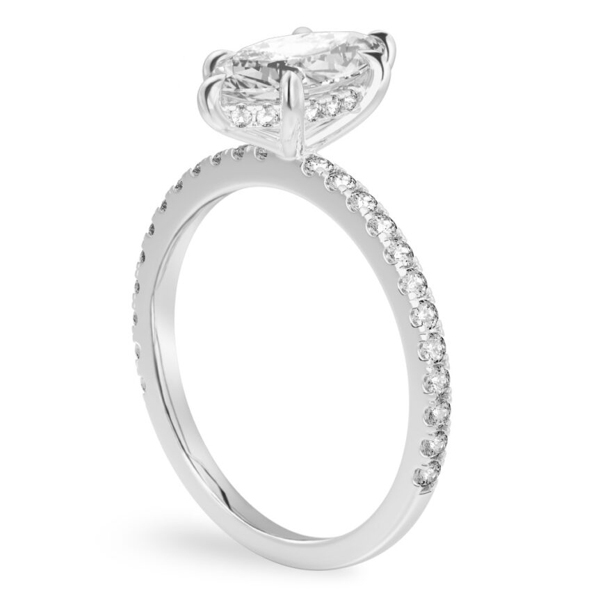 Angle view of marquise cut diamond delicate pave hidden halo engagement ring in platinum