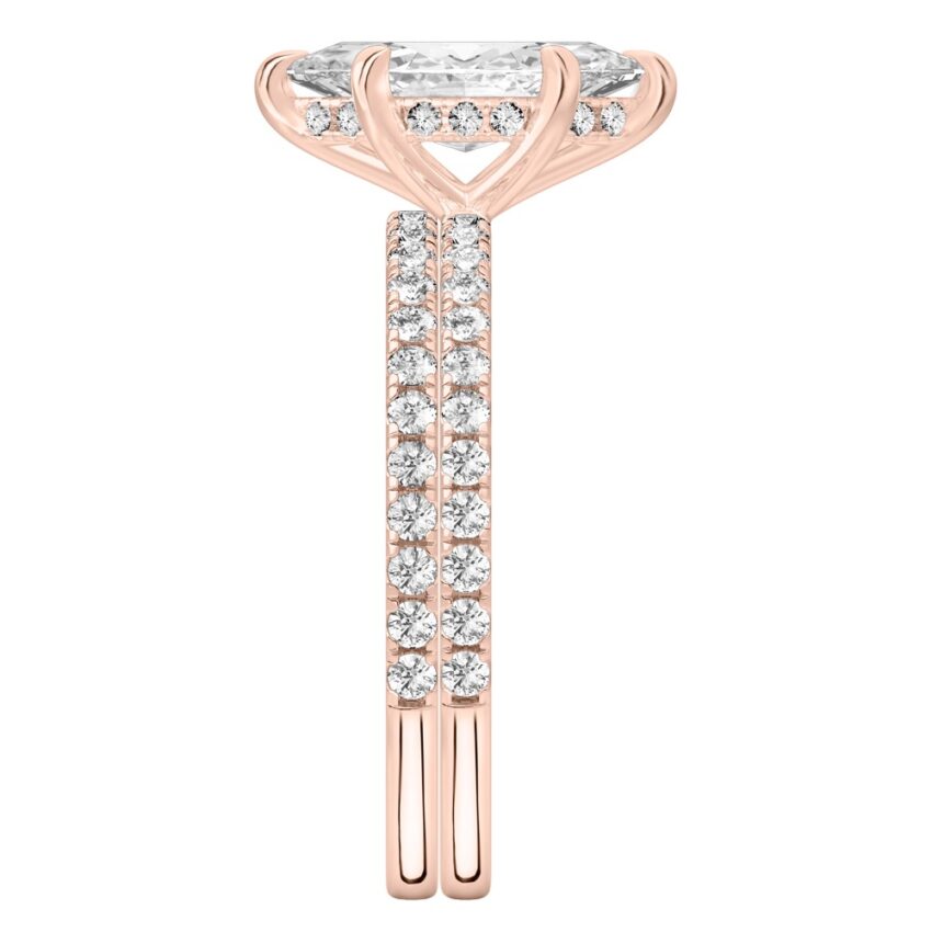 Side view of marquise cut diamond delicate pave hidden halo engagement ring set rose gold