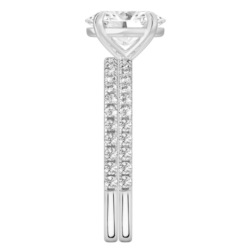 Side view of oval cut diamond delicate pave engagement ring set platinum