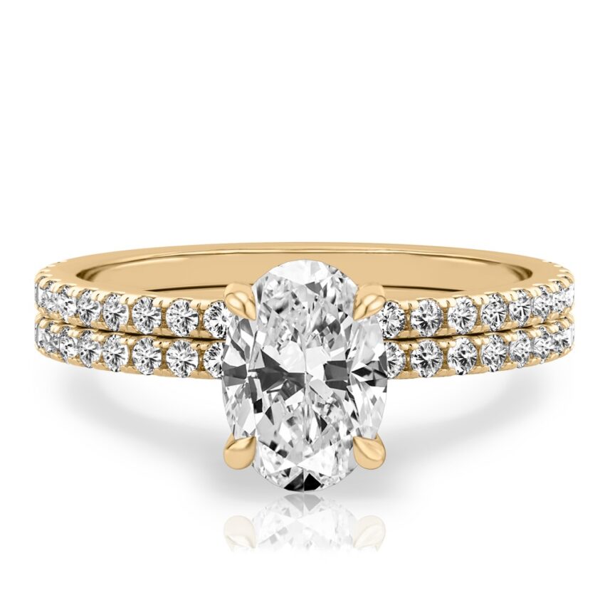 oval cut diamond delicate pave engagement ring set yellow gold