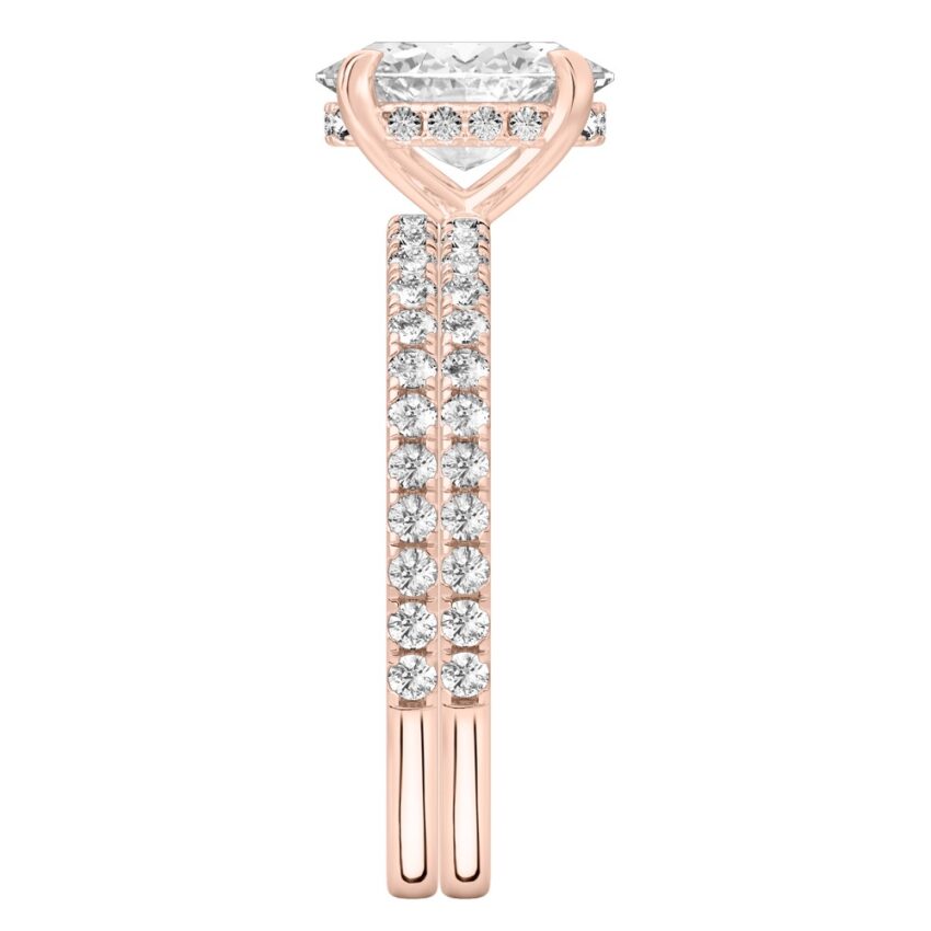 Side view of oval cut diamond delicate pave hidden halo engagement ring set rose gold