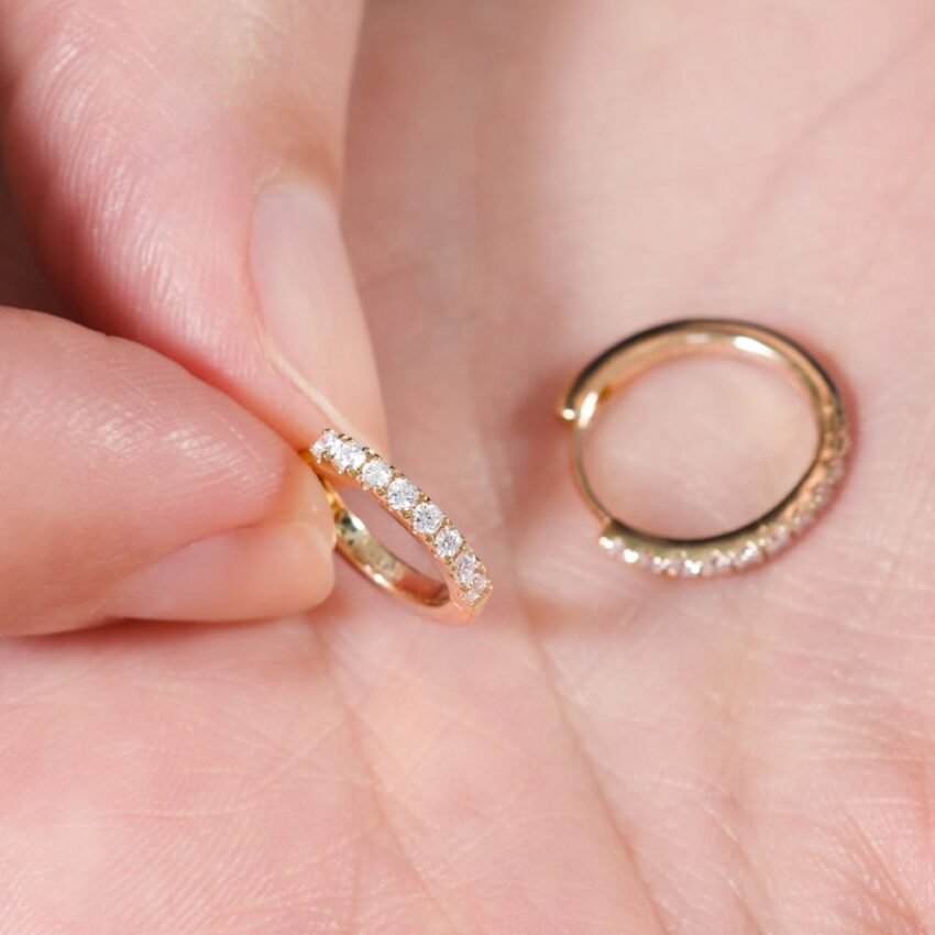 Angle view of pave diamond huggies lifestyle