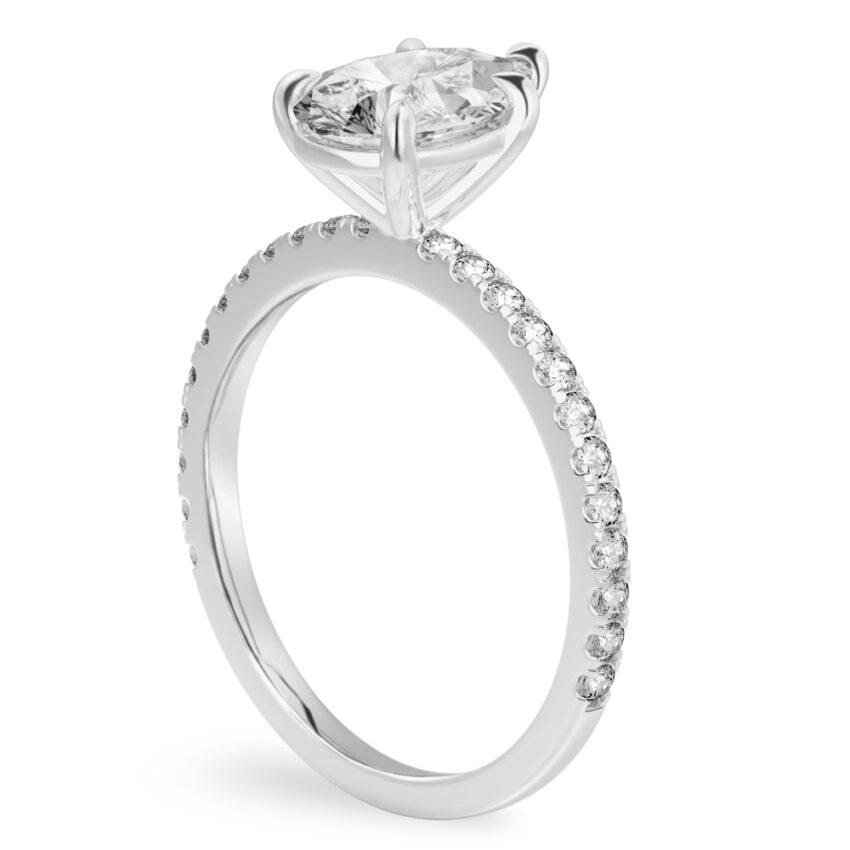 Angle view of pear shape diamond delicate pave engagement ring in palladium
