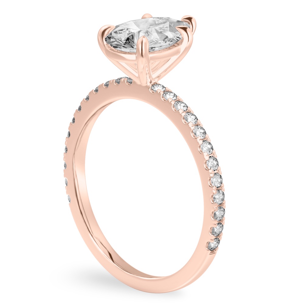 Angle view of pear shape diamond delicate pave engagement ring in rose gold