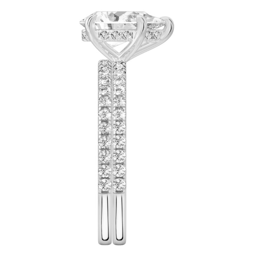 Side view of pear shape diamond delicate pave hidden halo engagement ring set platinum