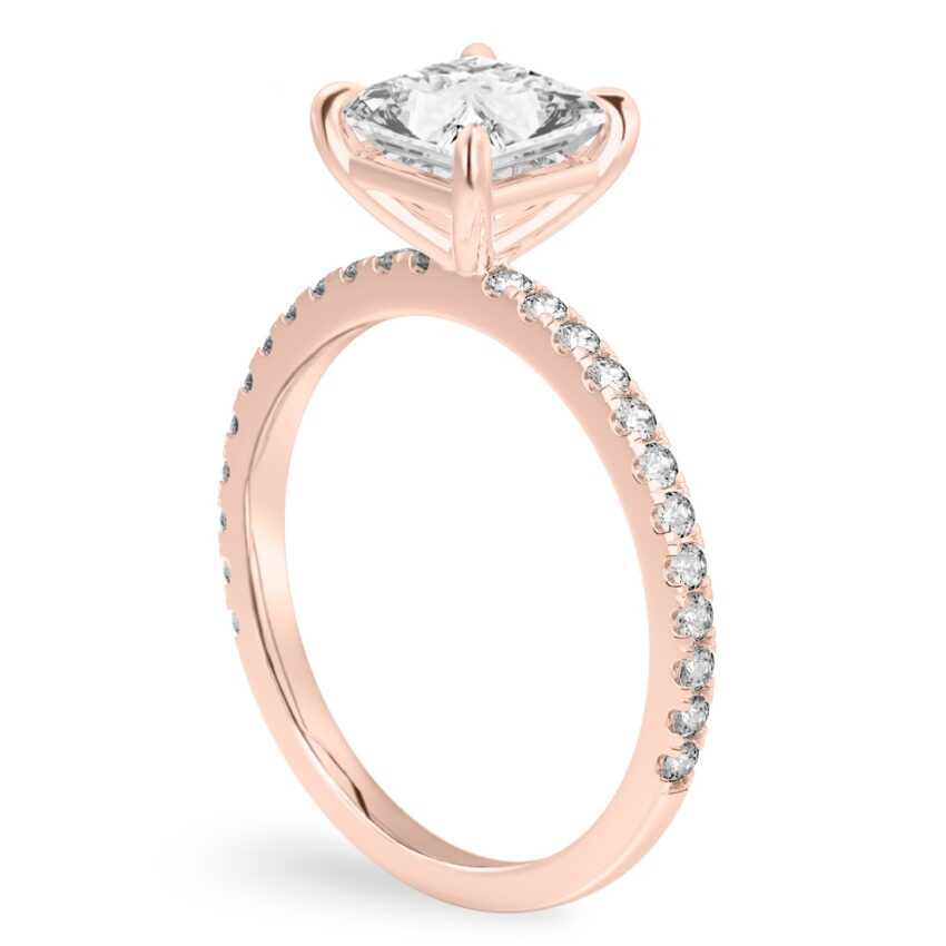 Angle view of princess cut diamond delicate pave engagement ring in rose gold