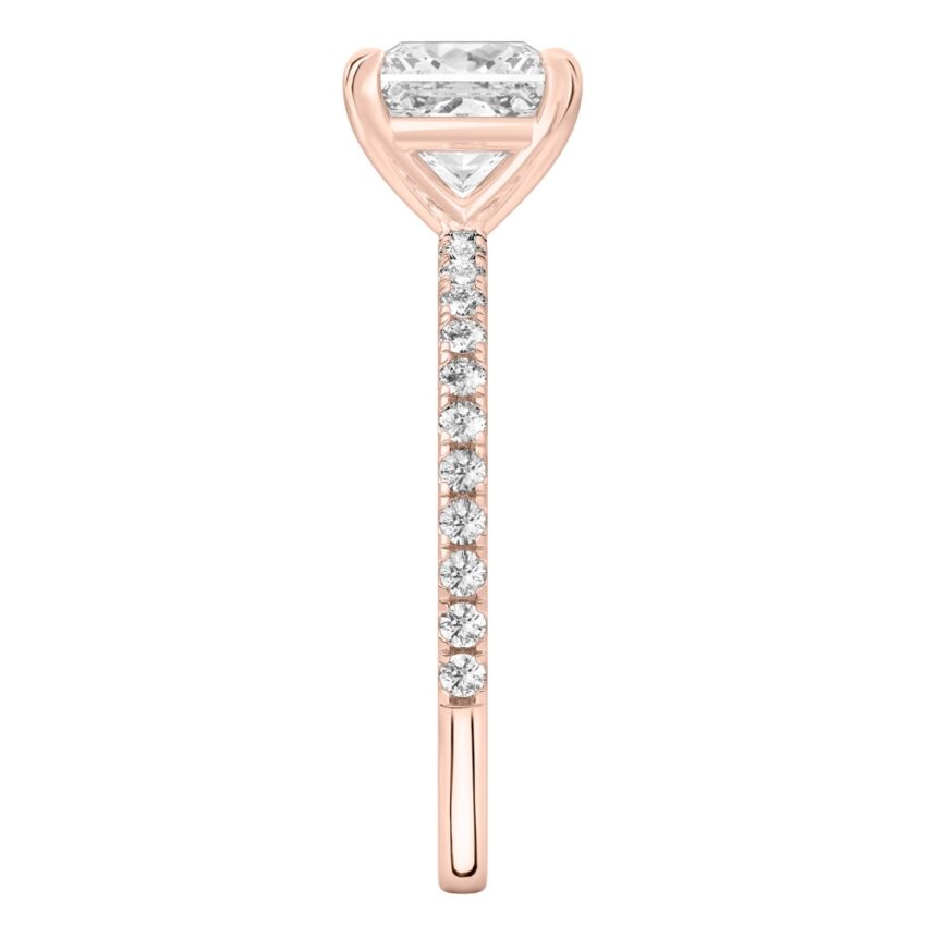 Side view of princess cut diamond delicate pave engagement ring in rose gold