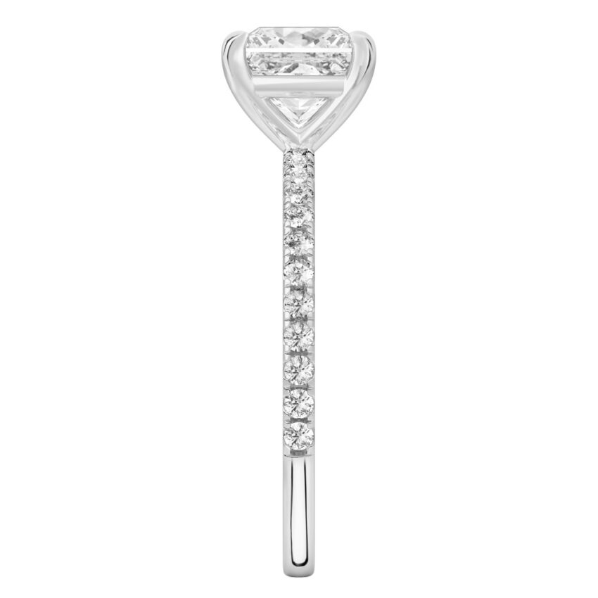 Side view of princess cut diamond delicate pave engagement ring in white gold