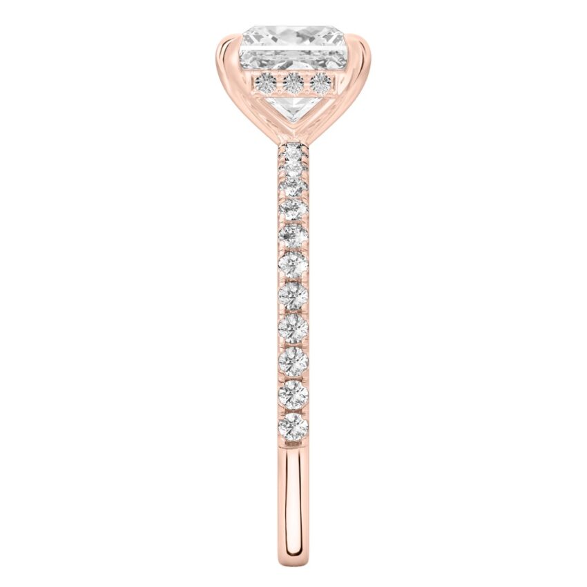Side view of princess cut diamond delicate pave hidden halo engagement ring in rose gold
