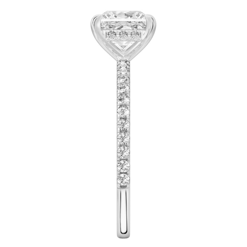 Side view of princess cut diamond delicate pave hidden halo engagement ring in white gold