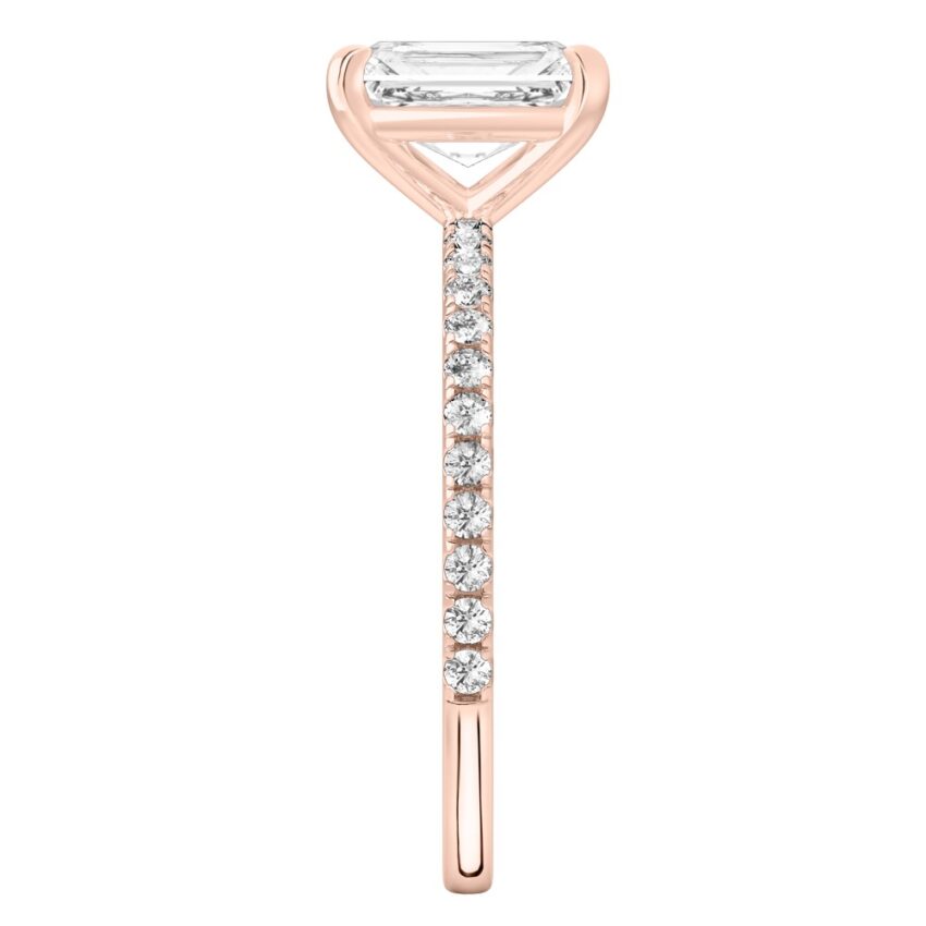 Side view of radiant cut diamond delicate pave engagement ring in rose gold