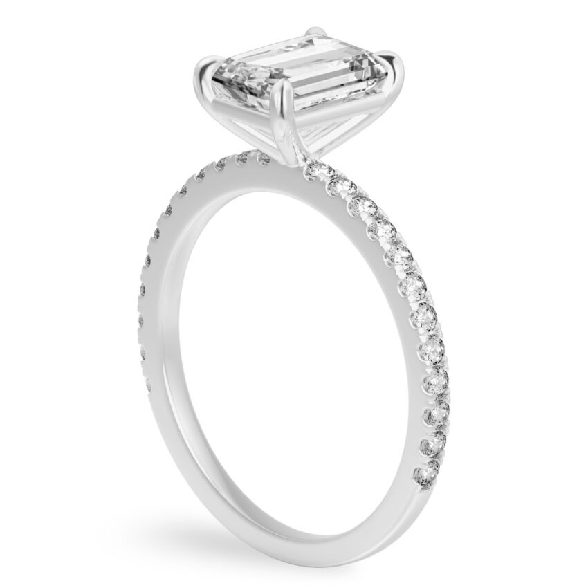 Angle view of radiant cut diamond delicate pave engagement ring in white gold