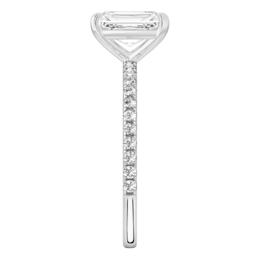 Side view of radiant cut diamond delicate pave engagement ring in white gold