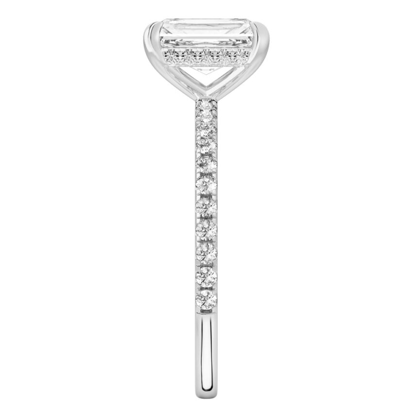 Side view of radiant cut diamond delicate pave hidden halo engagement ring in white gold