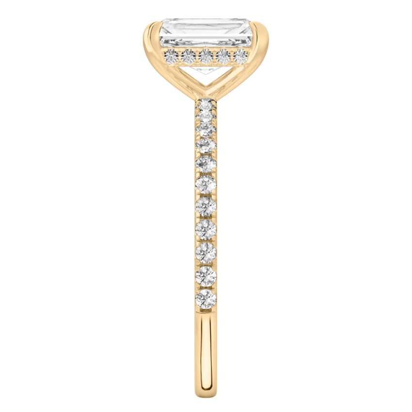 Side view of radiant cut diamond delicate pave hidden halo engagement ring in yellow gold