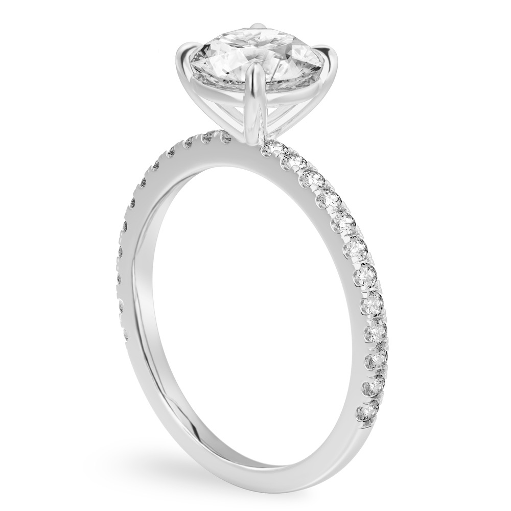 Angle view of round cut diamond delicate pave engagement ring in white gold