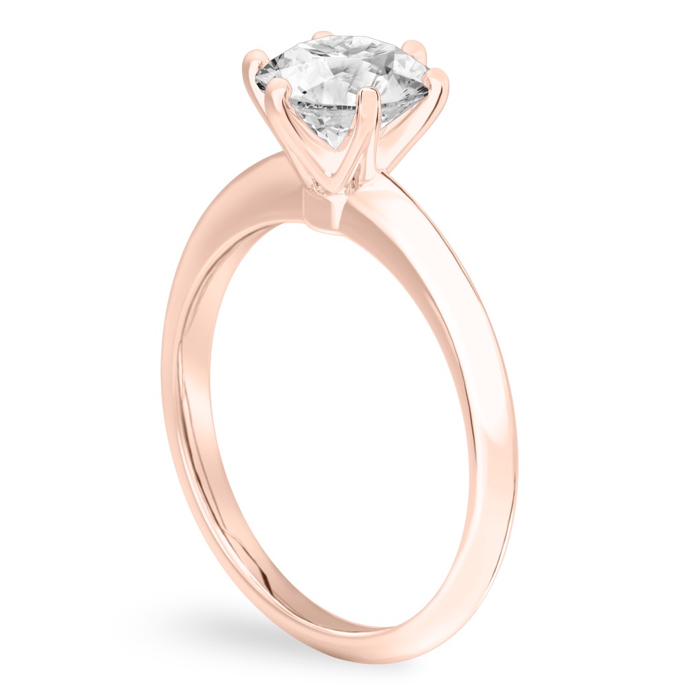 Angle view of round cut diamond six prong engagement ring in rose gold