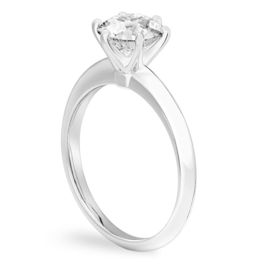 Angle view of round cut diamond six prong engagement ring in white gold