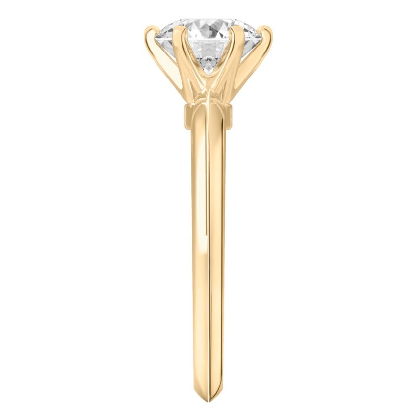 Side view of round cut diamond six prong engagement ring in yellow gold