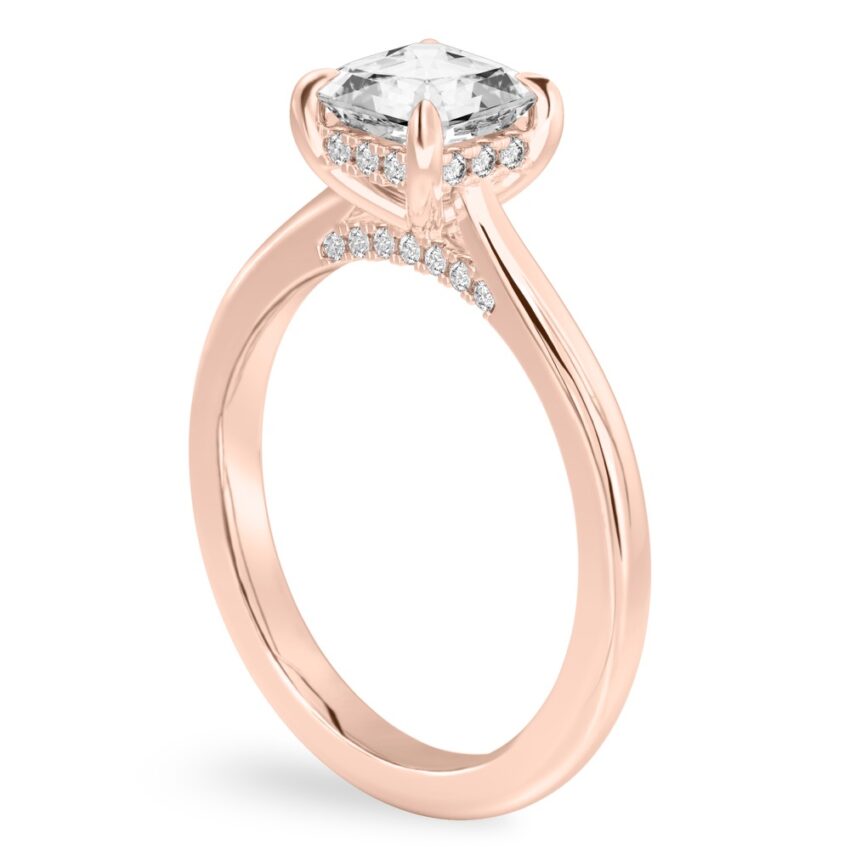 Angle view of asscher cut diamond pave bridge engagement ring in rose gold